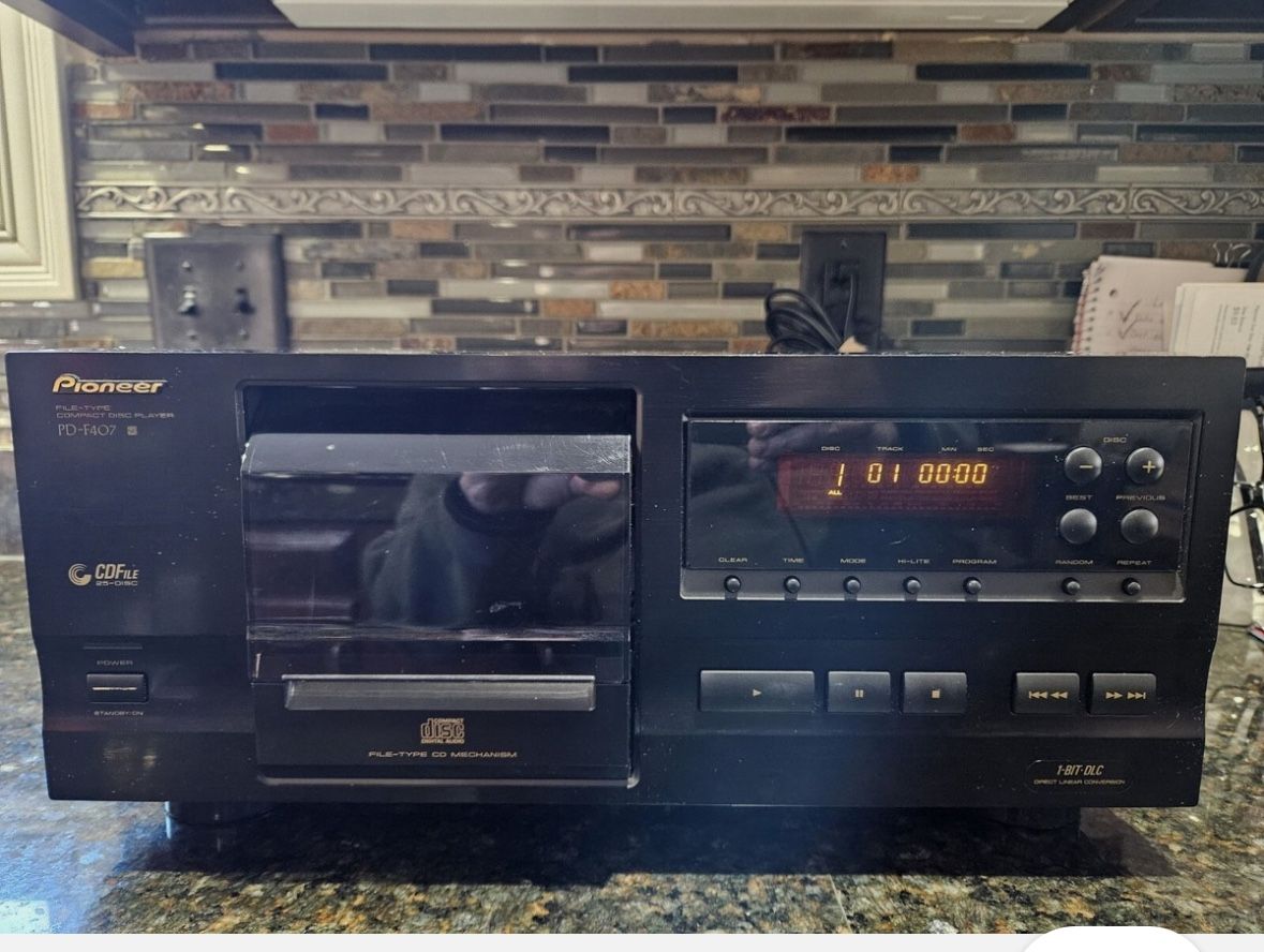 Pioneer PD-F507 25-disc CD changer and a Pioneer VSX-D307 audio/video multi-channel receiver. 