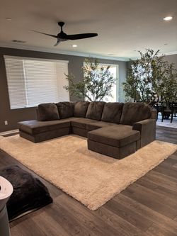 Brand New Ashley By Design Sectional With Multifunctional Ottoman