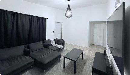 Couch, Entertainment Center, And Coffee Table