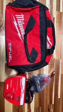 M12 4.0 ah battery, charger, and tool bag