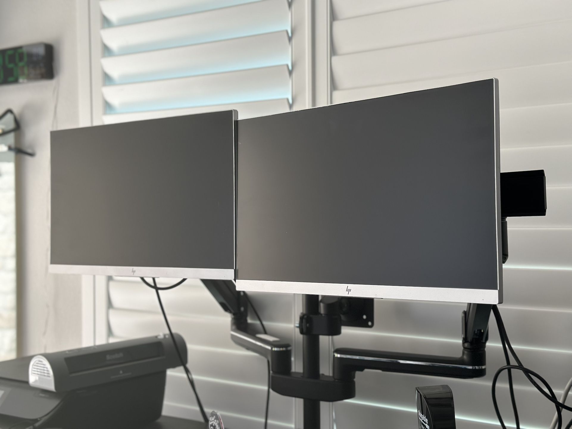 Dual HP monitors with heavy duty adjustable desk mount