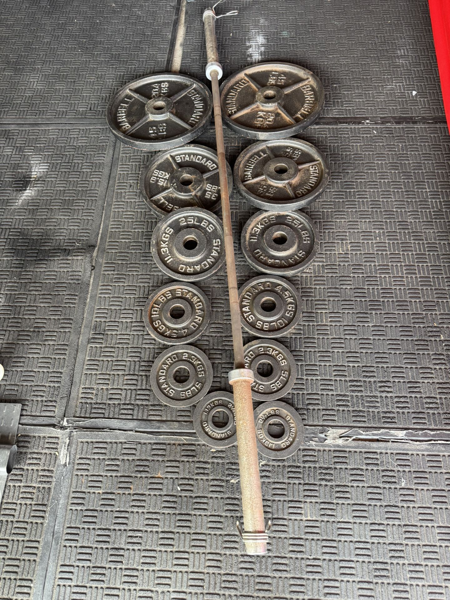 Olympic weights 245lbs plus 7ft 45lbs bar