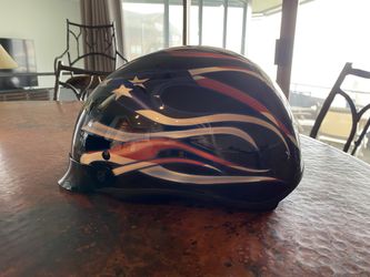 Harley Davidson “Old Glory” motorcycle helmet. Size small but feels like a medium. Worn only a few times. New this helmet sells for $210.