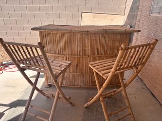 Bamboo tiki hut bar with chairs