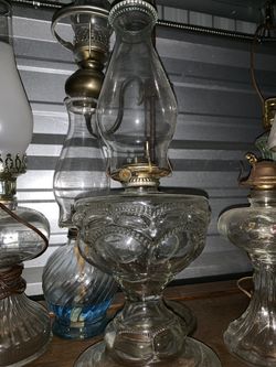 Very old draped oil lamp . Screws from inside