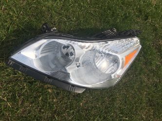 2012 Chevrolet Traverse left headlight