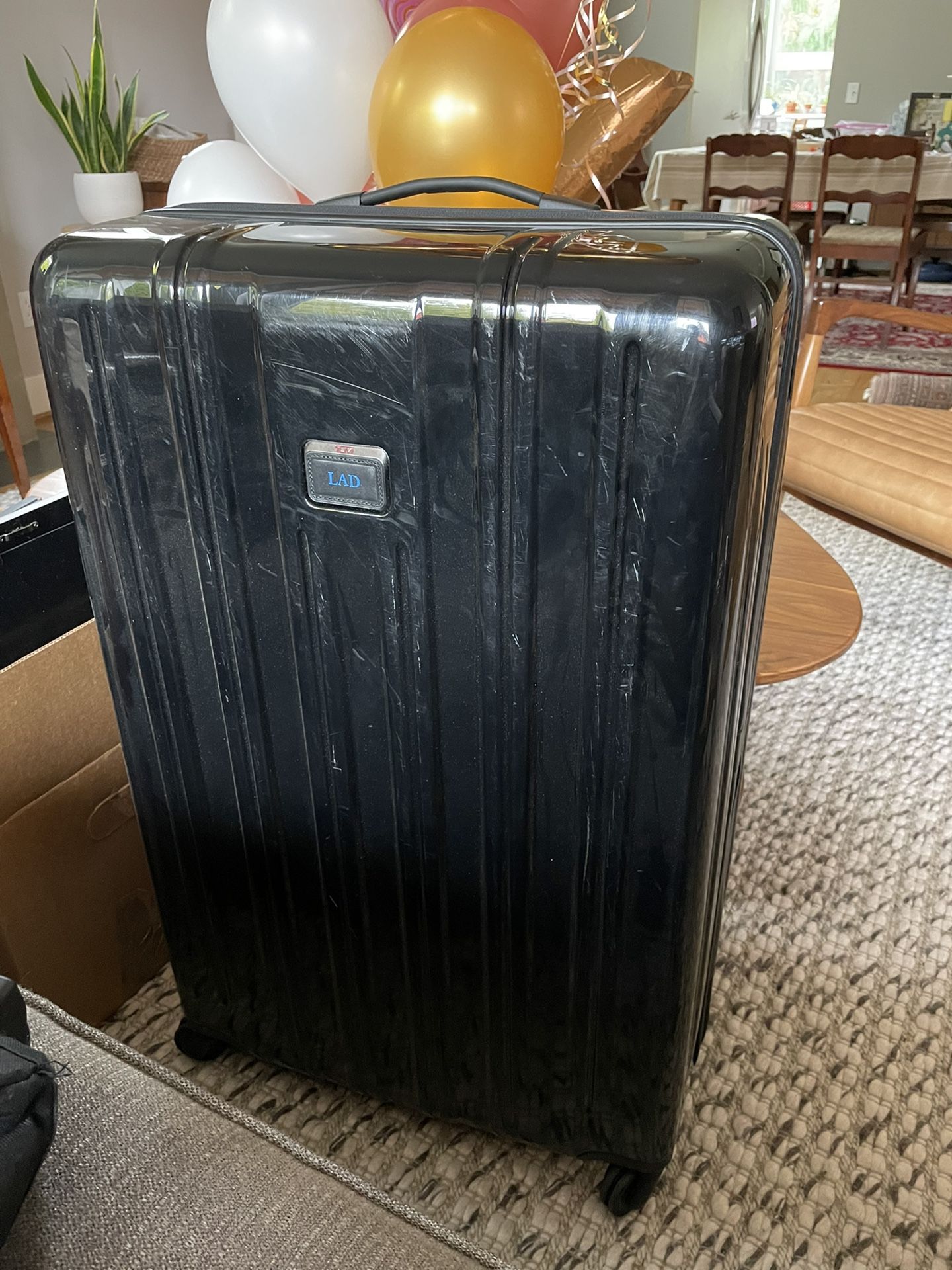 Large hard-sided Tumi Suitcase