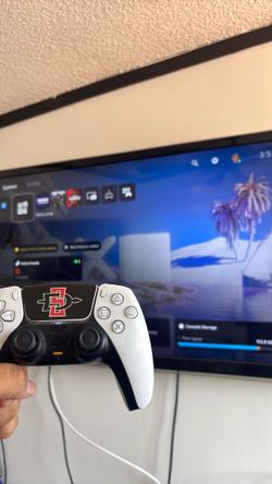 PlayStation 5 Slim with sdsu stickers