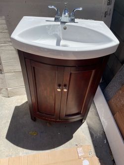 Used 24 1/2 bathroom vanity with sink and faucet