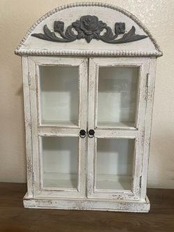 Elegant wooden cabinet with glass doors,
