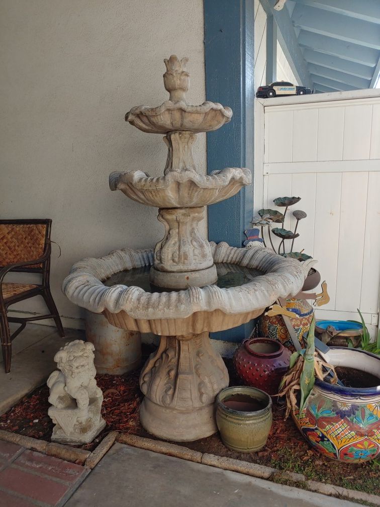 Concrete water Fountain with pump, works great. Over 5 feet tall. 3 tier.