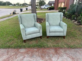 A PAIR OD KELLEX WINGBACK ACCENT CHAIRS