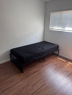Twin sized bed frame and mattress