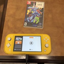 Yellow Nintendo Switch Lite with game and charger