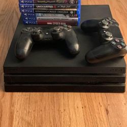 PS4 Pro with Games and Controllers 