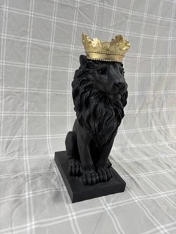 Small black lion statue