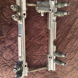 Fuel Rolling And Injectors For A Tune Port Engine