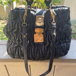 Authentic Black leather quilted Gorgeous vintage MIU MIU with crossbody strap 