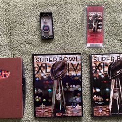 SUPER BOWL XLIV MEMAROBELIA. SAINTS vs COLTS. Game Program, Hologram Stadium Program, Ticket In Plexiglass, Notebook And Key Chain.
