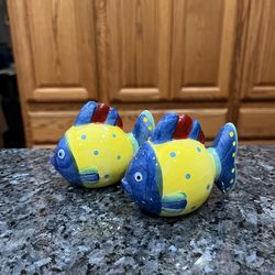 Bright Colorful Ceramic Fish pair of salt and pepper shakers.  Preowned .  Had been on display in a cabinet with a very large salt and pepper shakers 