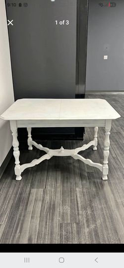 farmhouse-style dining table featuring white chalk paint and distressed