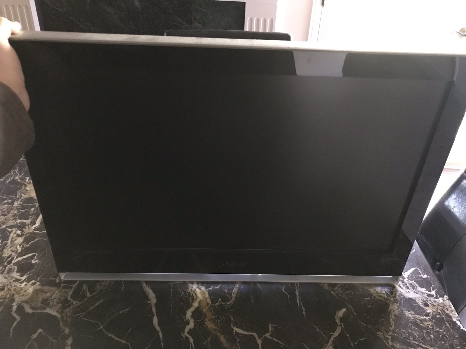 32 inch VIZIO TV with wall mount.