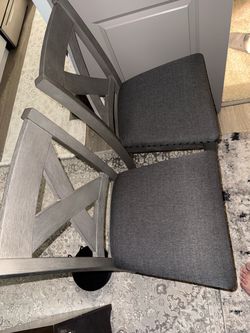 Two counter height chairs from Ashley Furniture