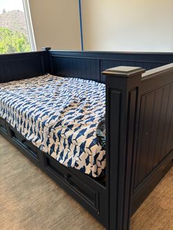 Navy Blue Daybed with three large drawers. Mattress included.