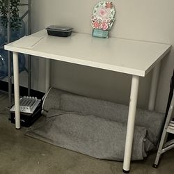 White dining table, seats 4. Minor scratches but overall in good condition.