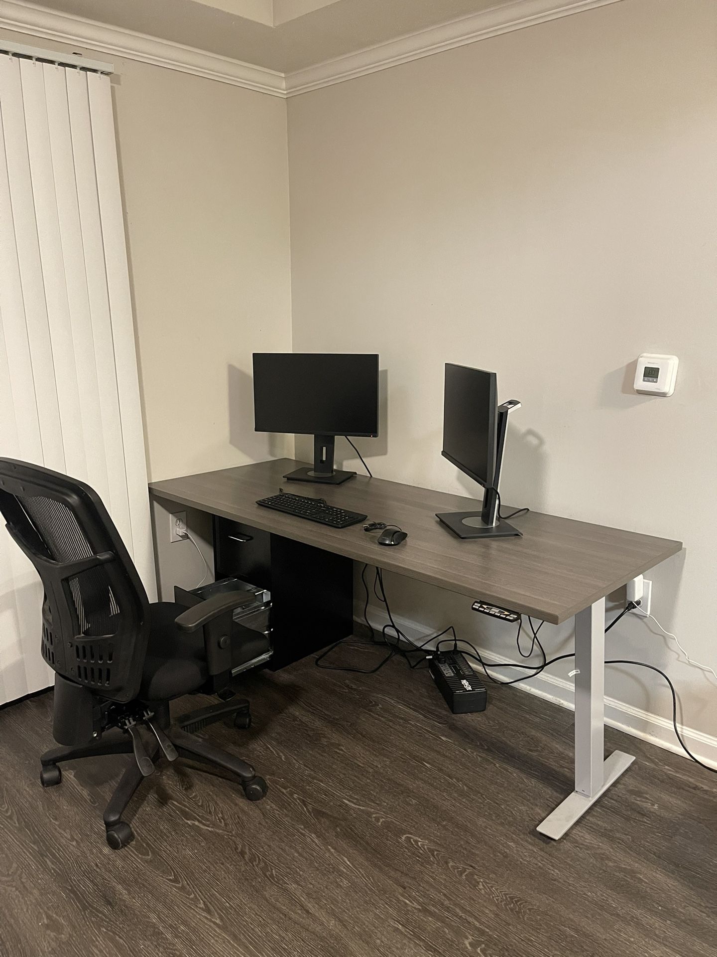 Work station with height adjustable desk