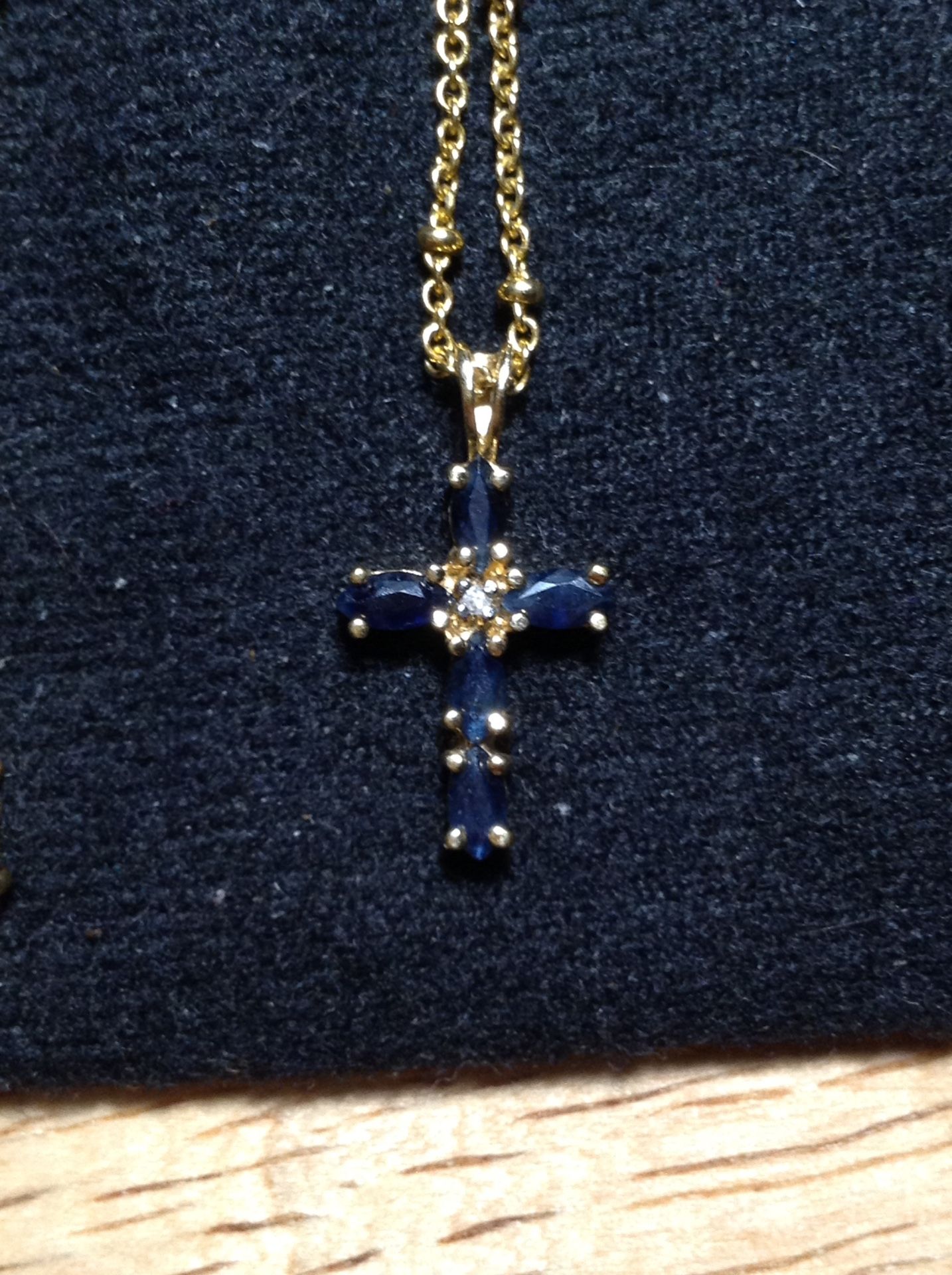 Sapphire Cross on a 16" gold chain