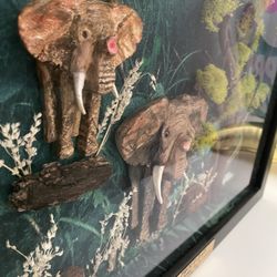 Very unique 1 of a kind 3-D effect beautiful hand sculpted and hand painted mother and baby elephant enclosed in a very expensive shadow box.   Set in