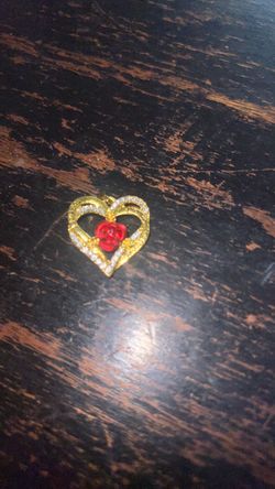 Go to heart with rose in the middle pendant
