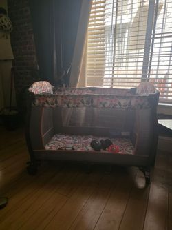 Free Babytrend play pen / crib /bassinet with mattress and stand