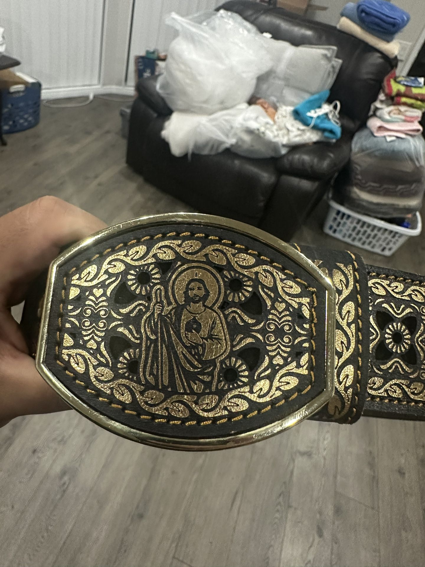 San Judas gold colored leather belt, laser cut design