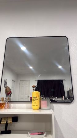 Large wall mirror with metal frame