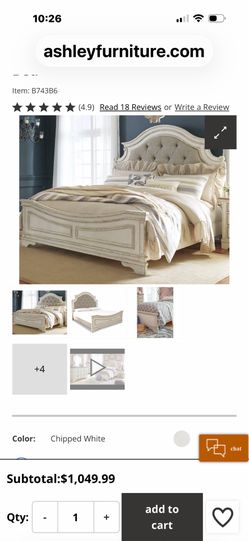 Realyn King Upholstered Panel Bed