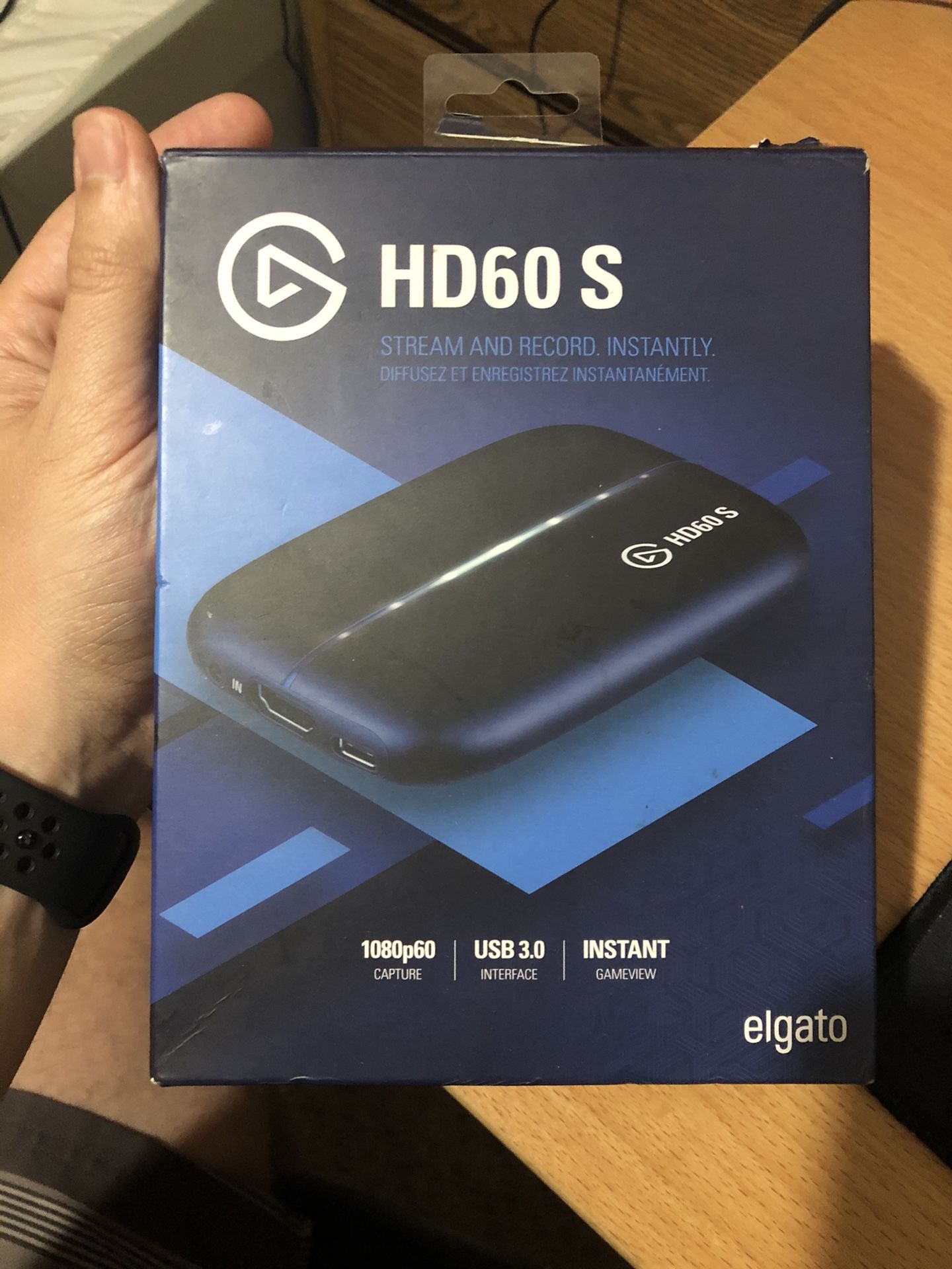 Elgato HD60s capture card in hand ready to ship