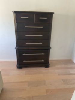 Tall dark wood dresser