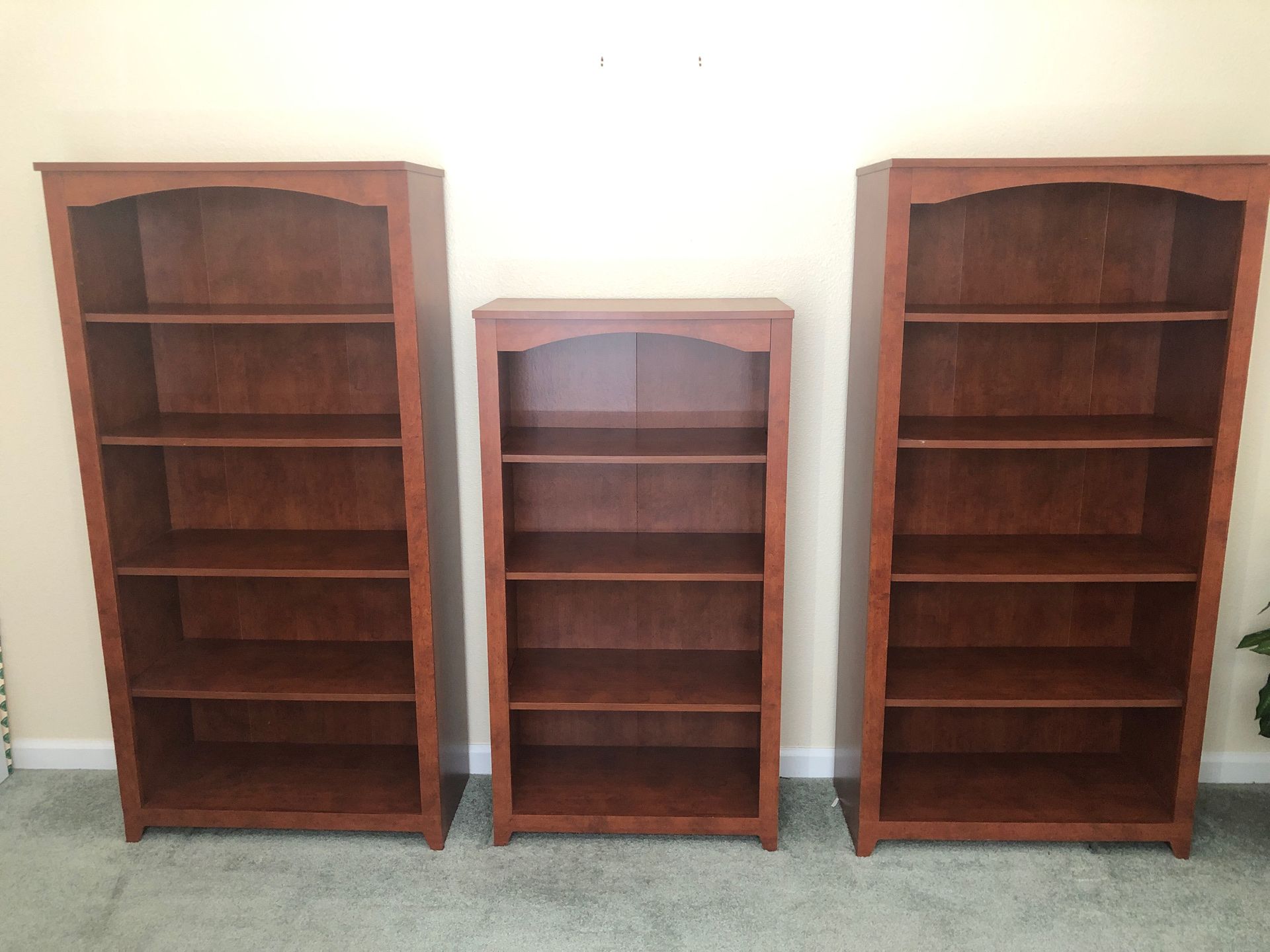 Bookshelves three pieces and the color is cherry