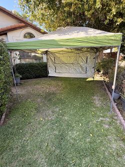 Coleman 10x10 Swing Wall Canopy with 2 chairs