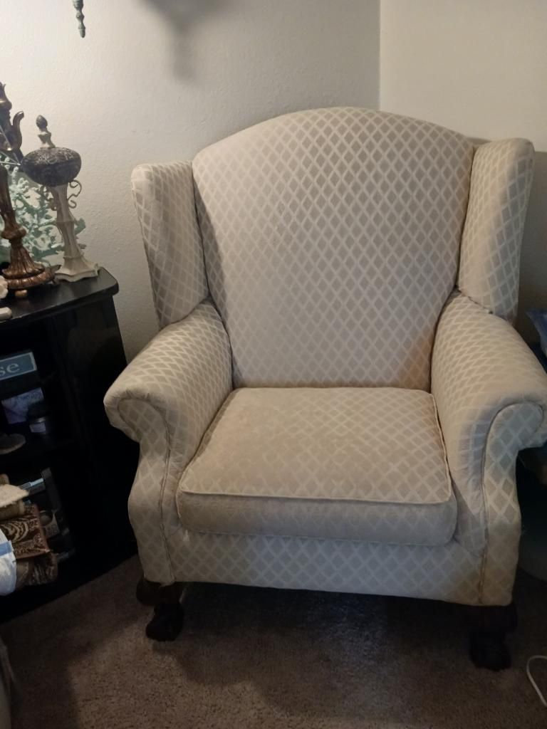 Two wingback chairs with claw feet