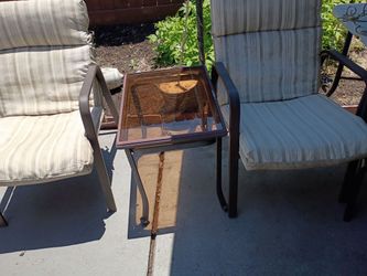 Two chairs and table chairs need new cushions asking 30