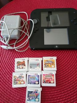 Nintendo 2ds sysyem with charger and 2 games( you pick the games)