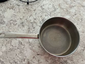 Stainless steel pot width 8”, height 3 1/2”, 7 1/2” handle length. Without lid. In perfect condition