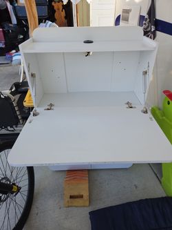 Fold down sewing cabinet