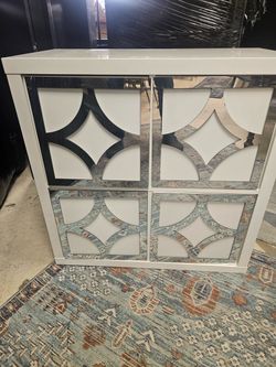 White Cabinet with Mirrored Geometric Doors