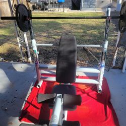COMPETITOR. OLYMPIC WEIGHT BENCH  LEG EXTENSION  ADJUSTABLE INCLINE  AND  BAR HEIGHT.  7'  45LB BAR  WITH CLIPS.  2 FITNESS GEAR 45LB PLATES 
11525 S 