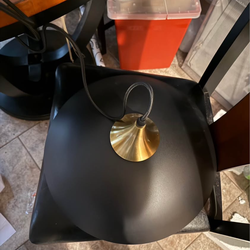 Eustace 17.7" Large Pendant Light in a matte black and gold finish.  Features a dome shade crafted from sturdy metal with a black finish and a copper-