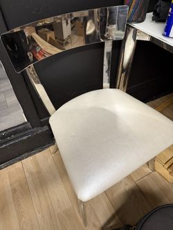 Set Of 2 - side chair features a polished chrome frame with a curved mirrored backrest upholstered seat.